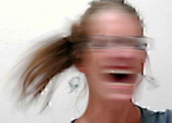A women shaking her head in the stress of her second deployment.