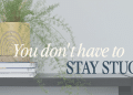 Plant in a yellow pot sits on a stack of books on a shelf, overlaid with the quote “You don't have to stay stuck.”